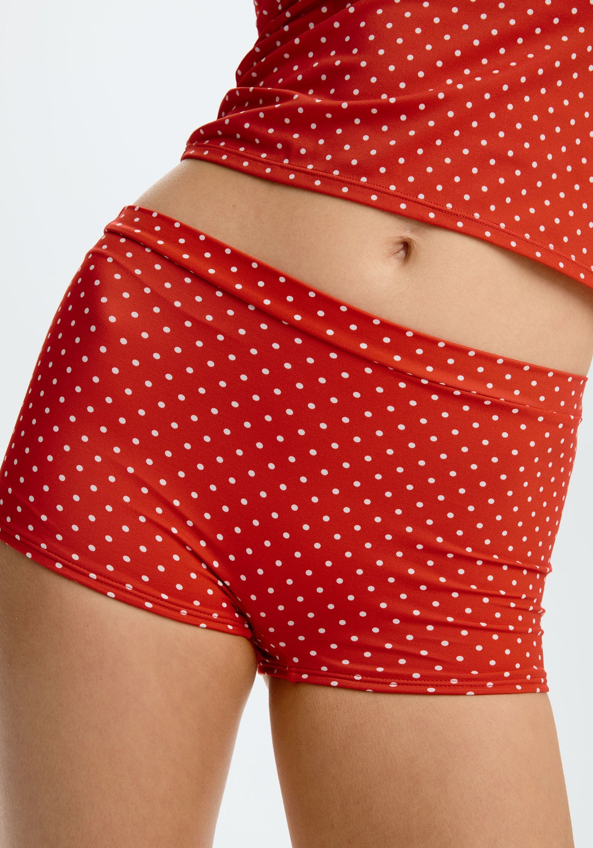 model is wearing an S bikini bottom - multi,red cove swim short