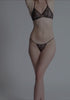 model is wearing an S panty - black cascade string thong