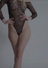 model is wearing an S bodysuit - black cascade bodysuit