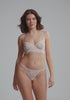 model is wearing a 34B bra - nude,white serene unlined balconette bra