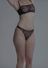 model is wearing an S panty - black cascade high leg thong