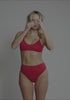 model is wearing an S bikini bottom - red drift high waist bikini bottom