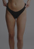 model is wearing an S panty - black the micro lace trim thong