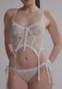 model is wearing an S corset - white belle corset