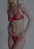model is wearing an S panty - red the mesh string