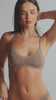 model is wearing an S bralette - nude the micro lace trim bralette
