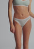 model is wearing an XS panty - green,multi the micro lace trim thong