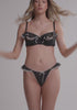 model is wearing an S panty - black,multi delphine crotchless thong