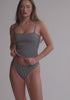 model is wearing an S bikini top - black,multi terra tankini bandeau top