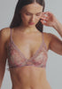 model is wearing an S bralette - multi lotus bralette