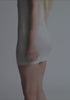model is wearing an S slip - grey whisper bamboo slip