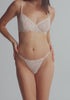 model is wearing a 32D bra - white the lace unlined bra