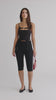 model is wearing an S corset-black orbit corset