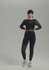 model is wearing an S top-black pulse long sleeve crop top