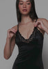 model is wearing an S slip-black luster slip