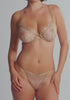 model is wearing an S panty - gold celeste string