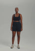 model is wearing an S tank-black core crop tank