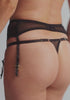 model is wearing an S/M garter belt - black enchant garter belt