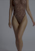 model is wearing an XS bodysuit - multi the mesh bodysuit