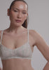model is wearing an S bralette - multi althea bralette