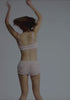model is wearing an XS bloomer - multi,pink willow bloomer