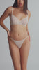 model is wearing a 32D bra - white the lace unlined bra
