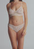 model is wearing an S panty - white the lace cheeky