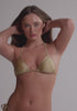 model is wearing an S bikini top - gold petra triangle bikini top