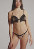 model is wearing an S bralette - black liora fringe bralette